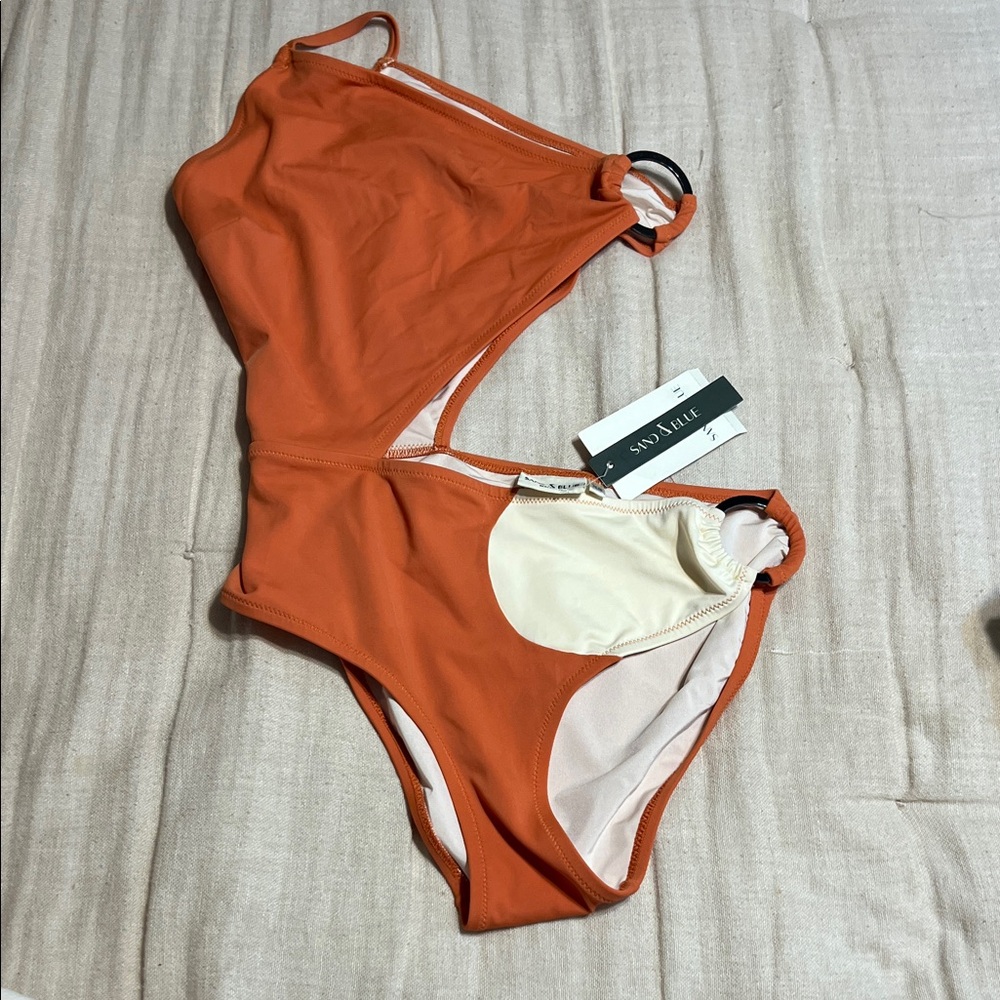 Sand & Blue Women's azymetric one shoulder One-Piece Swimsuit in Rust and Cream